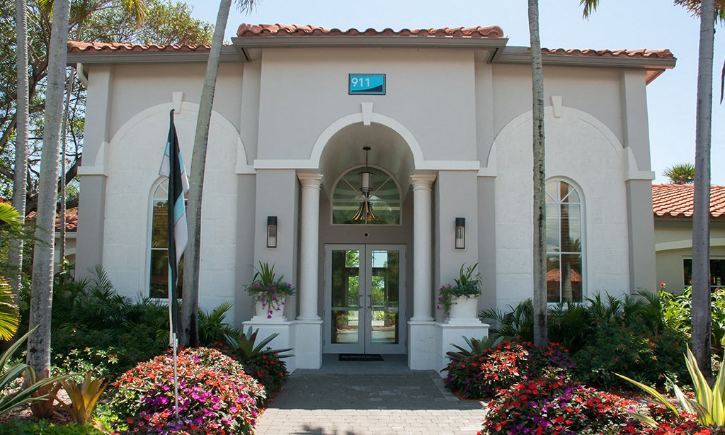 a building with a door and a sign on top of it