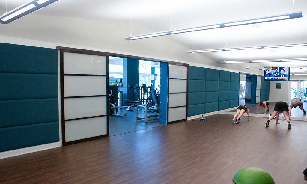 a group of people working out in a gym