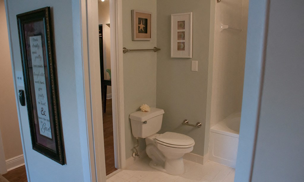 a small bathroom with a toilet and a shower