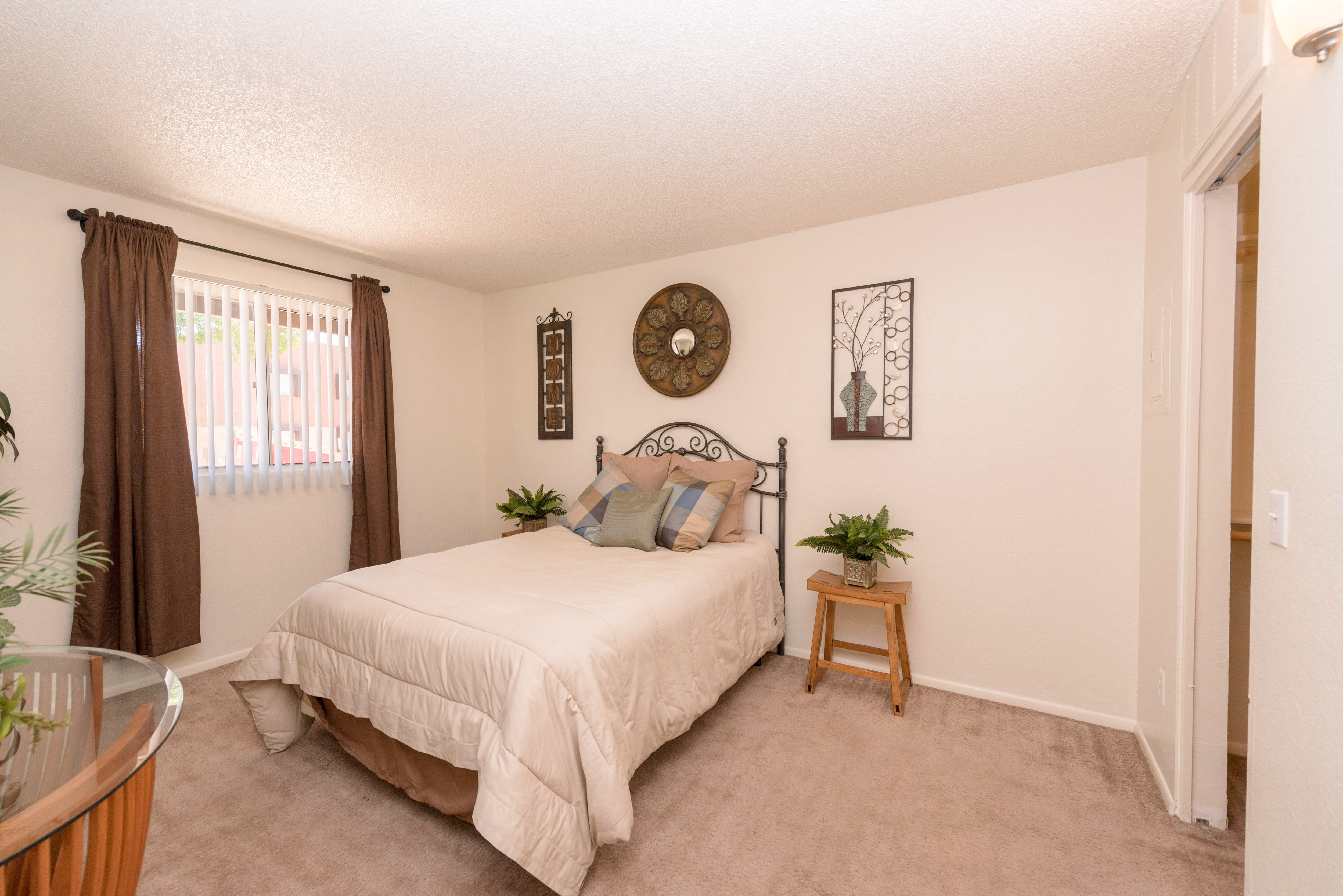 a bedroom with a bed and a window