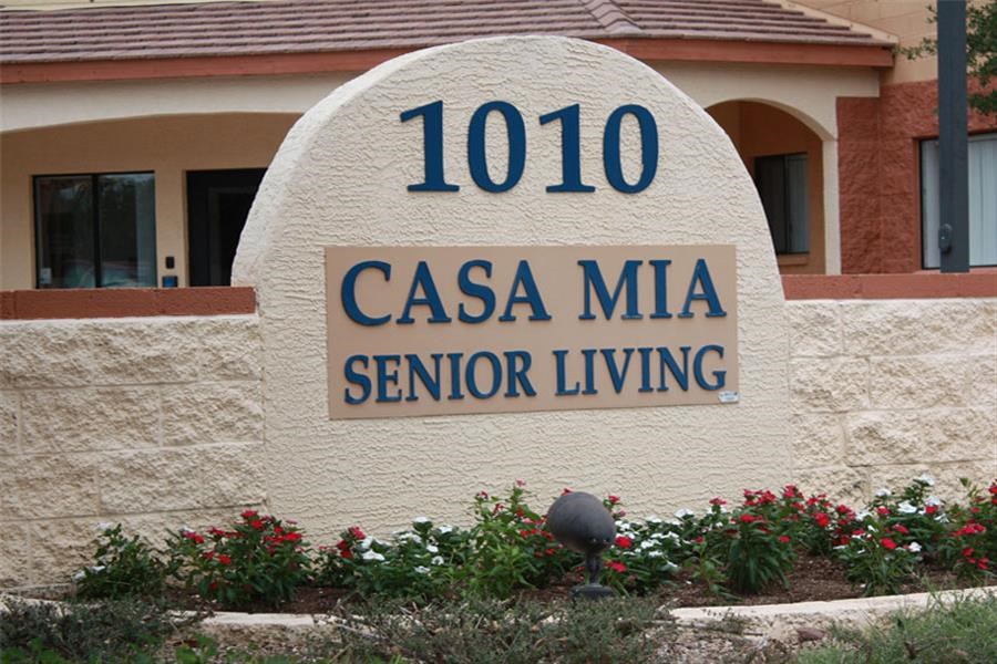 a cement sign with the words senior living on it