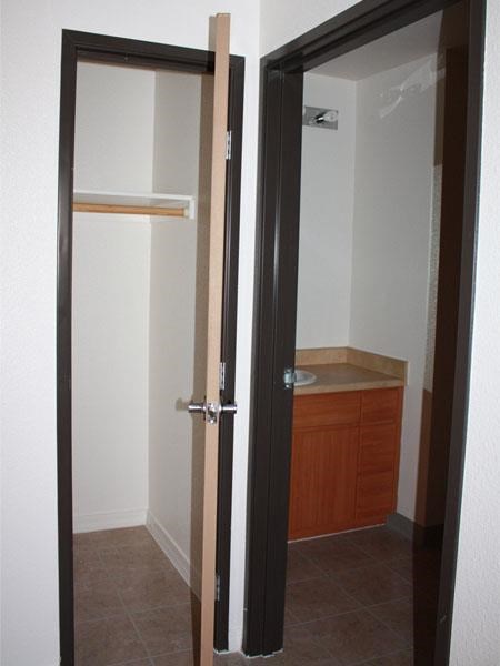 a bathroom with a door open and a sink