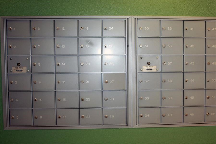 a wall with many lockers in a room