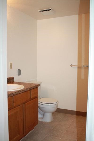 a bathroom with a toilet and a sink