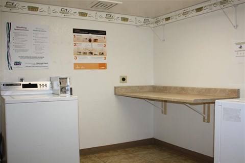 a kitchen with a sink and a refrigerator