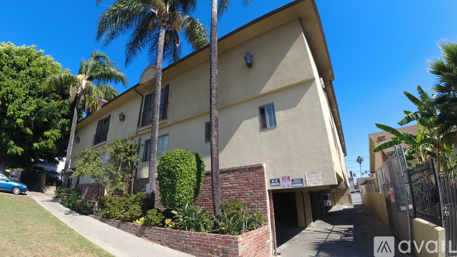 A house with a palm tree in front of it.