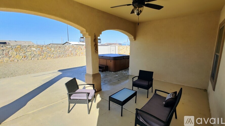 A patio with a table and chairs is available for rent.