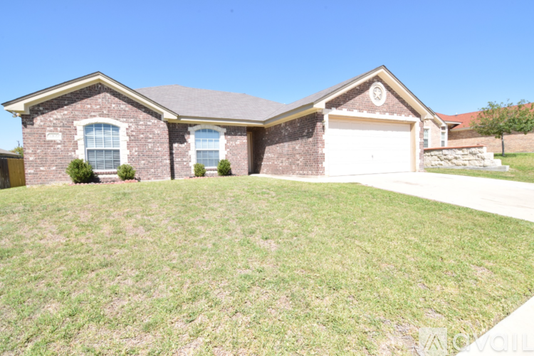 A house with a garage and a driveway.