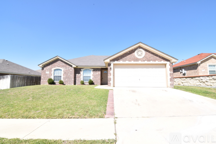 A house with a garage is for sale.