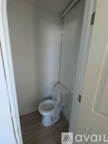 A small bathroom with a toilet and a bidet.