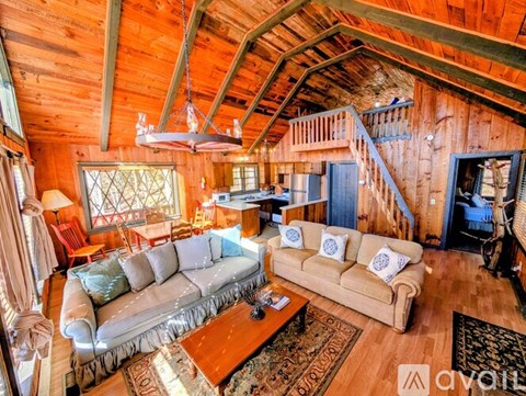 A living room with a couch and a coffee table.