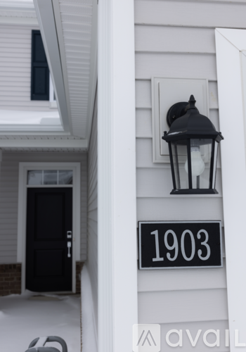 A black and white photo of a house number 1903.