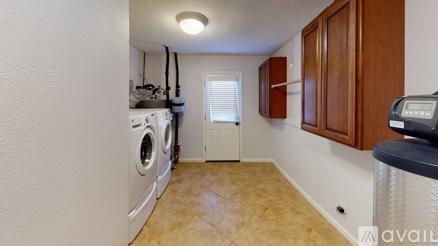 A laundry room with a washer and dryer.