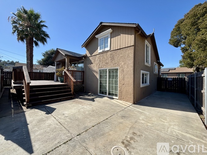A house with a brown and beige exterior is for sale.