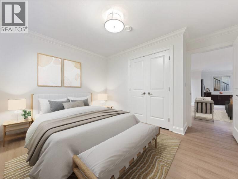 A bedroom with a large bed and a wooden bench.