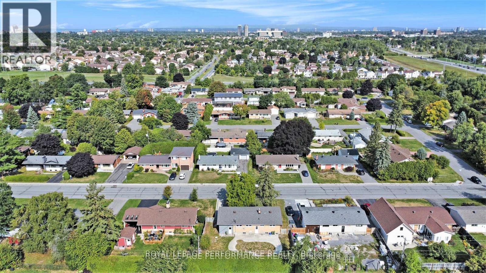 A bird's eye view of a residential area with houses and trees.