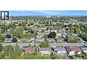 A bird's eye view of a residential area with houses and trees.