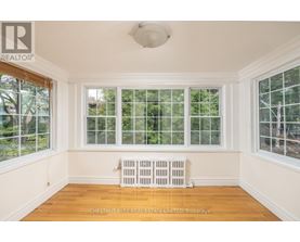 A room with a window and a radiator.