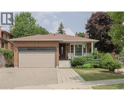 A house with a garage is for sale.
