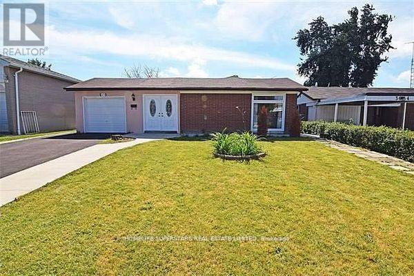 A house with a lawn in front of it.