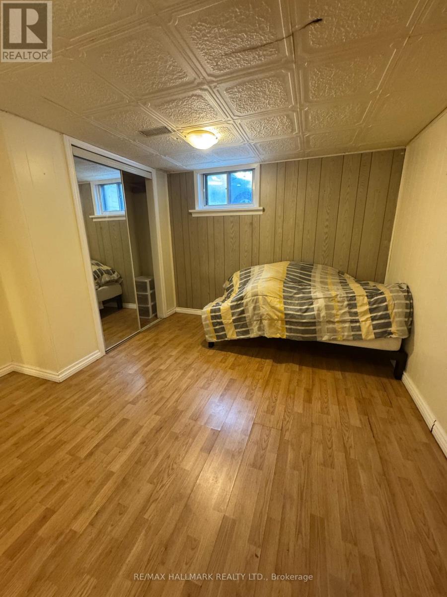 A bedroom with a bed and a window.