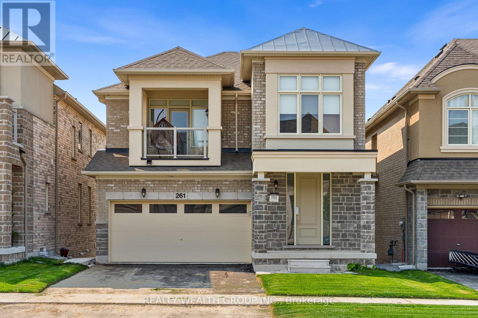A two-story house with a garage is for sale.