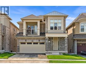 A two-story house with a garage is for sale.
