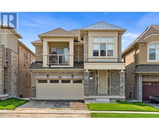 A two-story house with a garage is for sale.