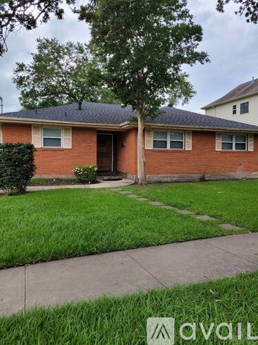 A house with a tree in front of it.