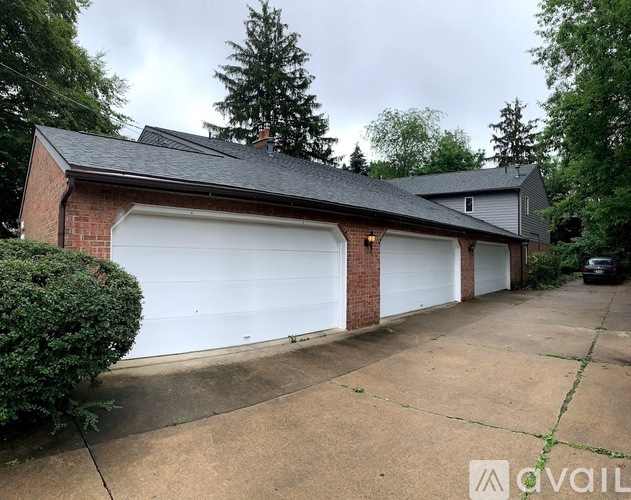 A two-car garage with a brick exterior and a white interior.