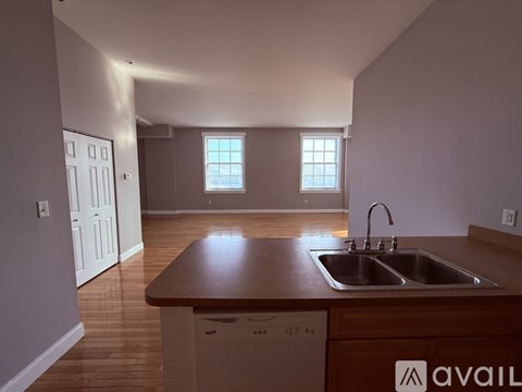 A kitchen with a sink and a dishwasher.