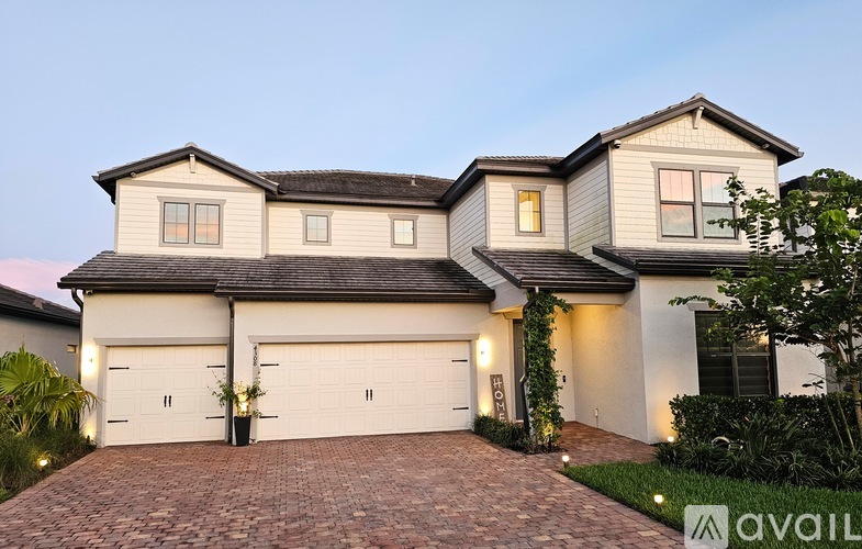 A house with a garage is available for sale.