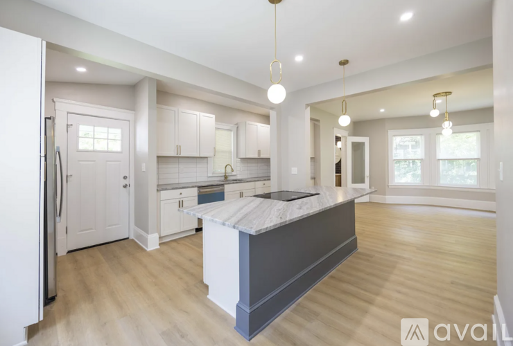 A modern kitchen with a large island in the middle.