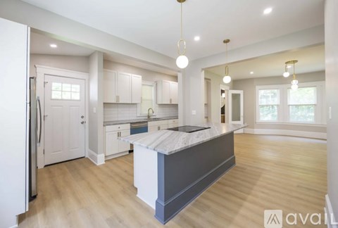 A modern kitchen with a large island in the middle.
