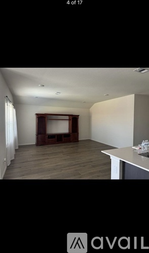 A room with a desk and a window.