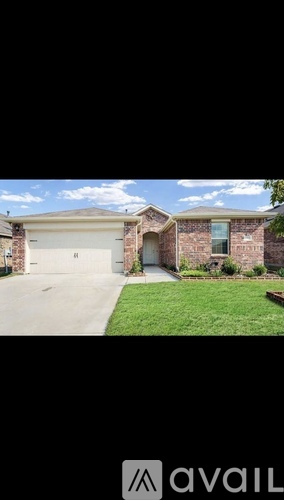 A house with a garage and a driveway.