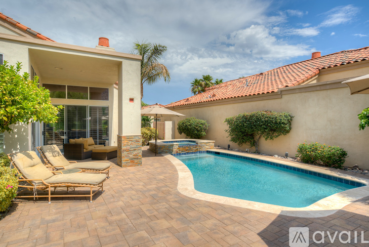 A house with a pool in the backyard.