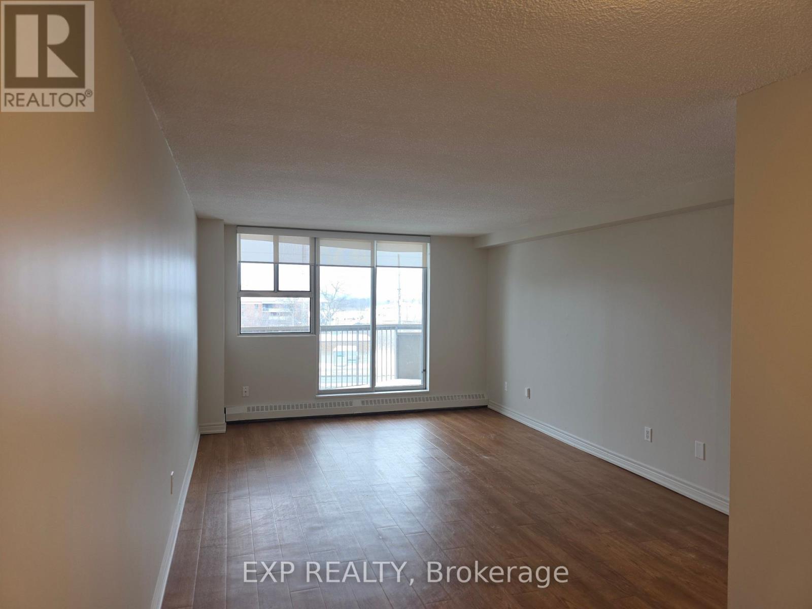 A room with EXP Realty, Brokerage written on the floor.