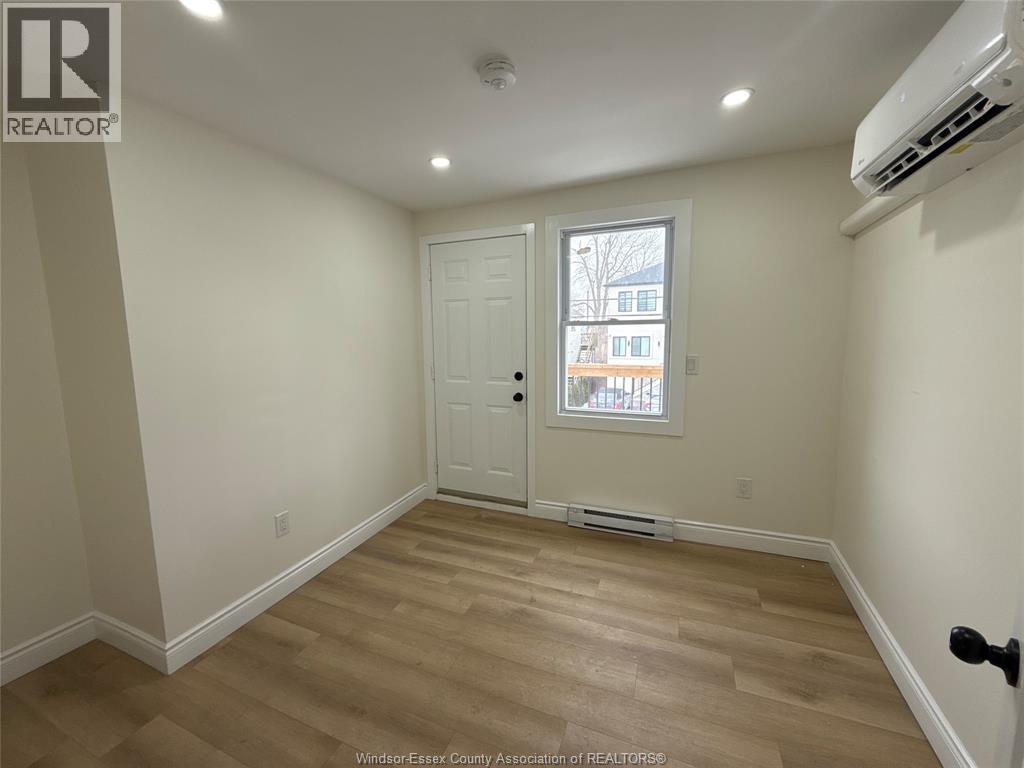 A room with a door and a window.
