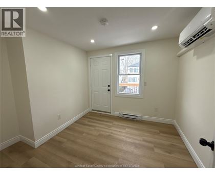 A room with a door and a window.