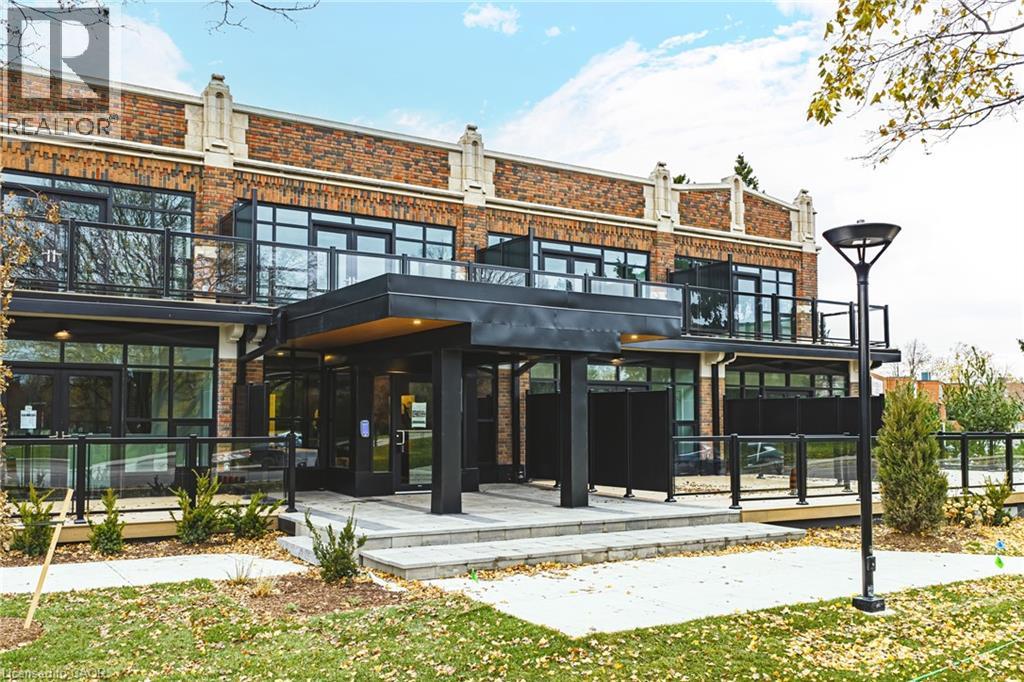A modern building with a glass entrance and a brick facade.