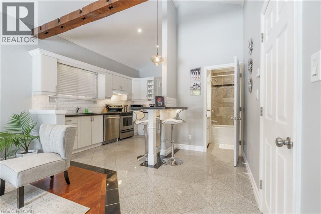 A modern kitchen with a dining table and chairs.