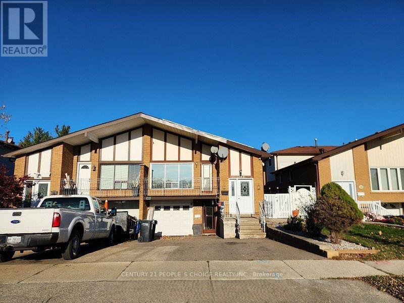 A realtor photo of a house with a white truck parked in front.