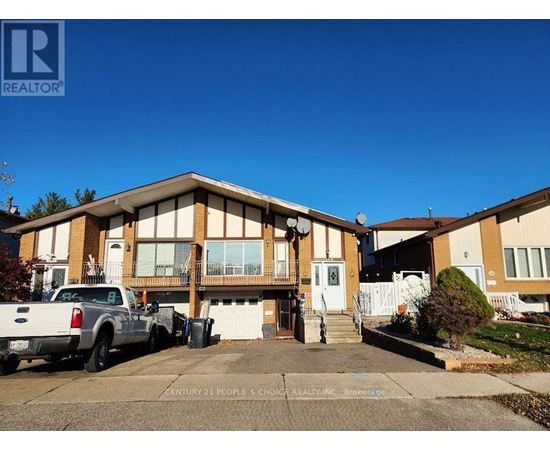 A realtor photo of a house with a white truck parked in front.