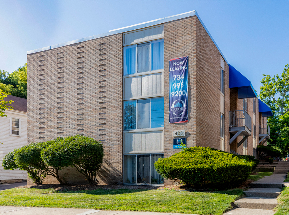 a brick building with a banner on the side of it