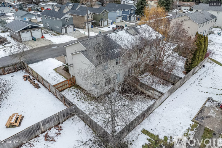 A snow-covered residential area with a house in the center.