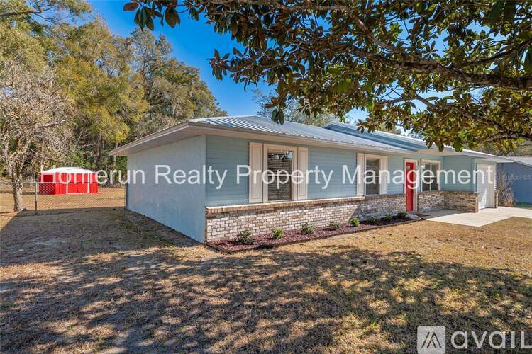 A house with the text "Tower Run Realty Property Management" in front of it.