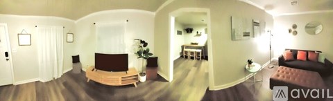A living room with a couch and a television.