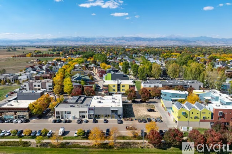 A small town with a mountain range in the background.