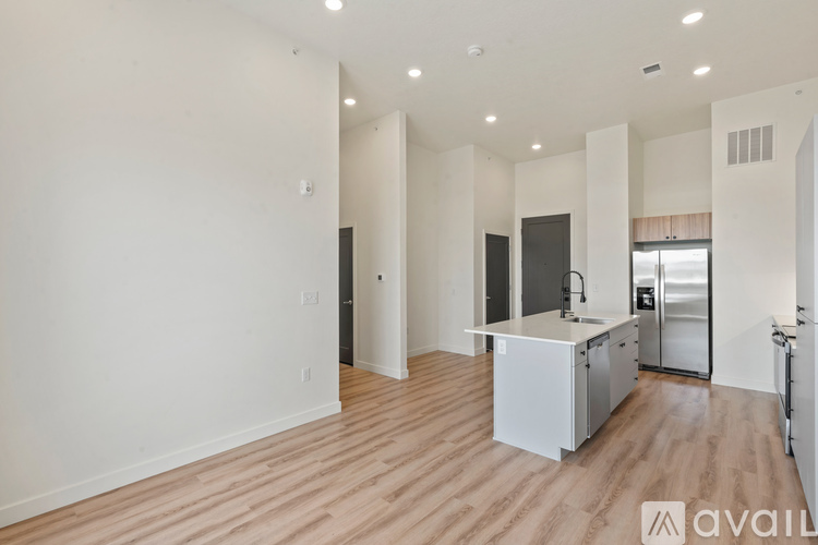 A kitchen area with a white cabinet and a sink.